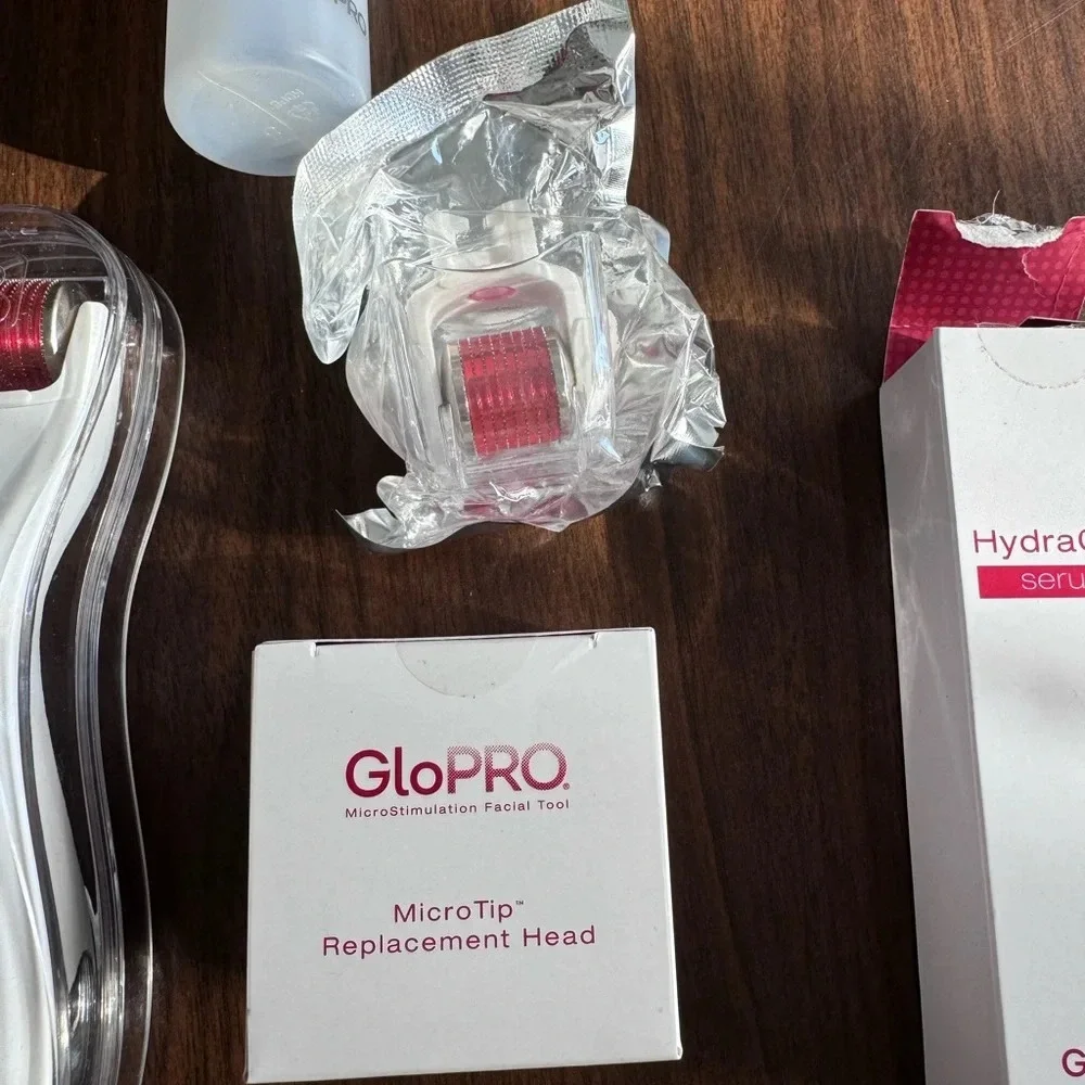 GloPRO micro stimulation facial tool with 2 extra heads and serum